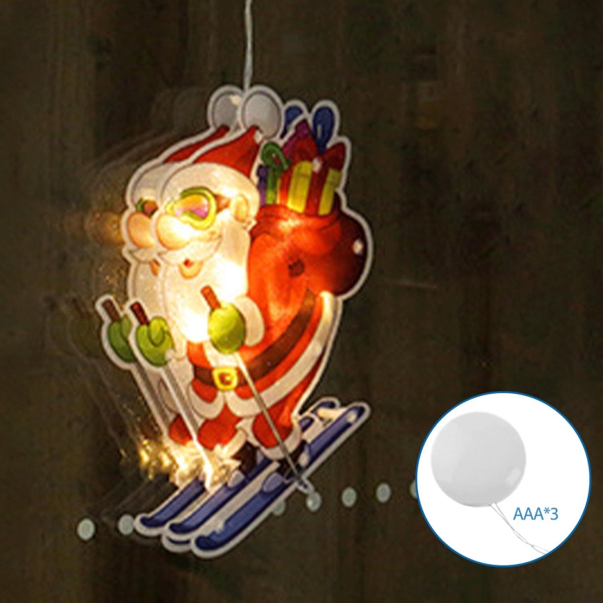 Aigostar - Decoração de Natal LED LED/3xAAA Pai Natal nos esquis 23cm
