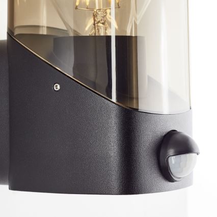 Brilliant - Iluminação de parede exterior com sensor MINOU 1xE27/10W/230V IP44 preto/fumado