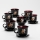 Conjunto 6x copo de vidro com pires e 1x açucareiro preto buquê no. 3