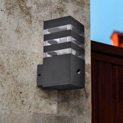 Iluminação de parede exterior com sensor TEKSAS 1xE27/12W/230V IP44 antracite
