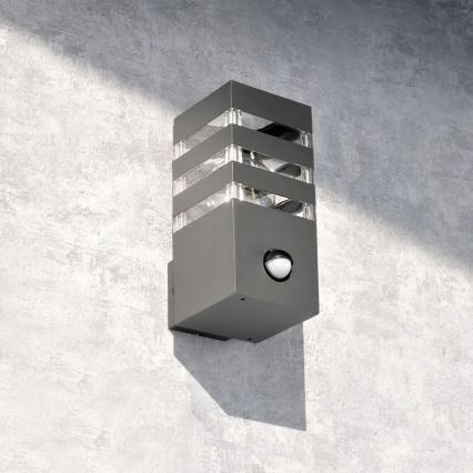 Iluminação de parede exterior com sensor TEKSAS 1xE27/12W/230V IP44 antracite
