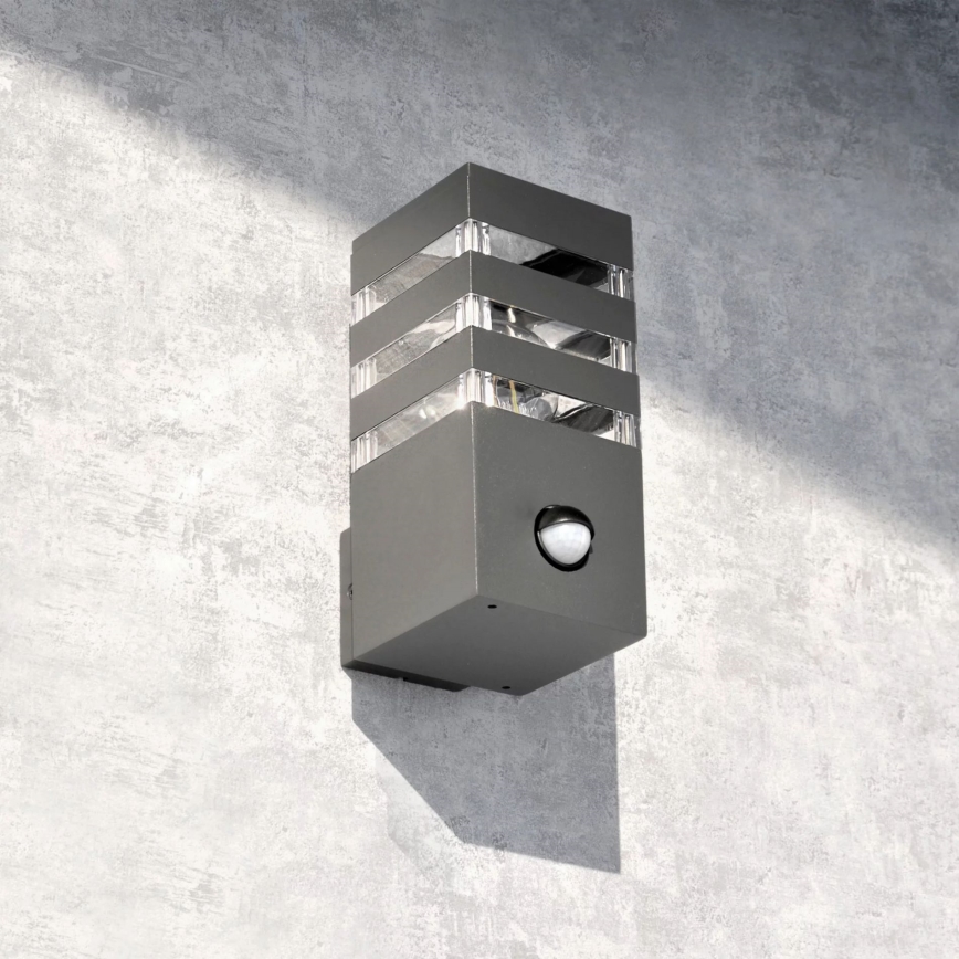 Iluminação de parede exterior com sensor TEKSAS 1xE27/12W/230V IP44 antracite