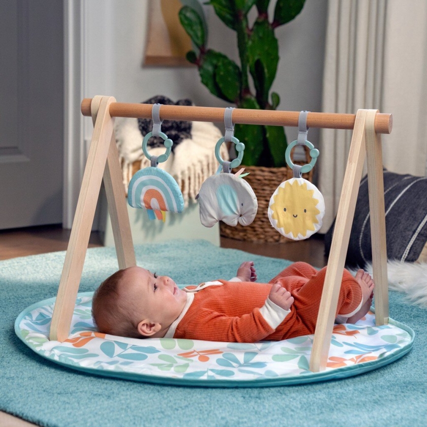 Ingenuity - Cobertor infantil para brincar com um trapézio de madeira SOL VALLEY
