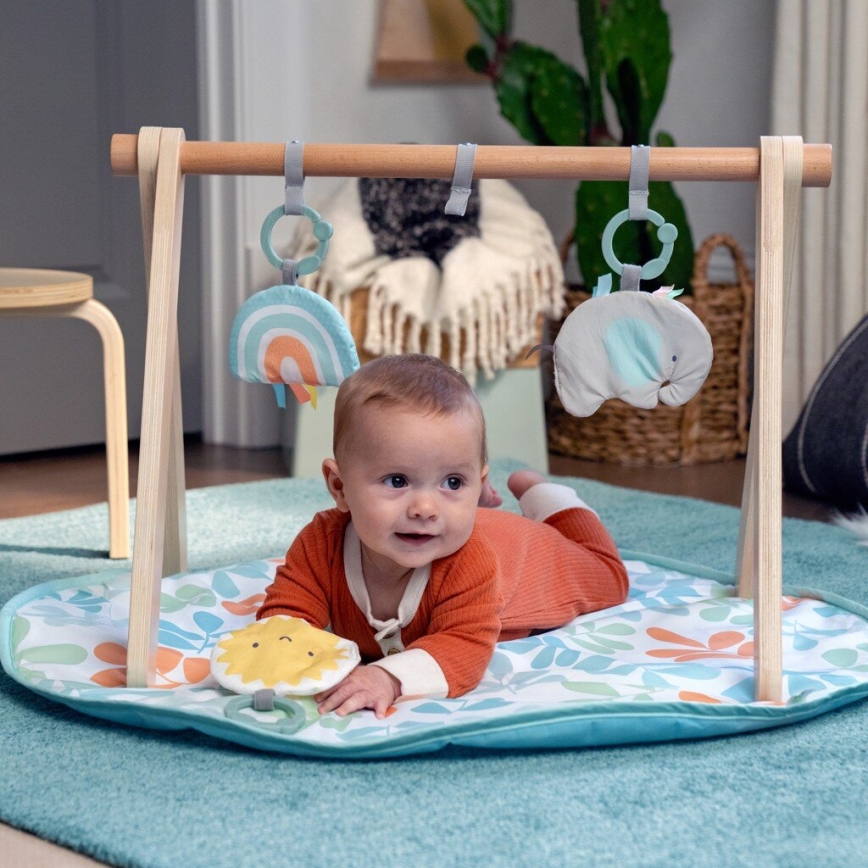 Ingenuity - Cobertor infantil para brincar com um trapézio de madeira SOL VALLEY